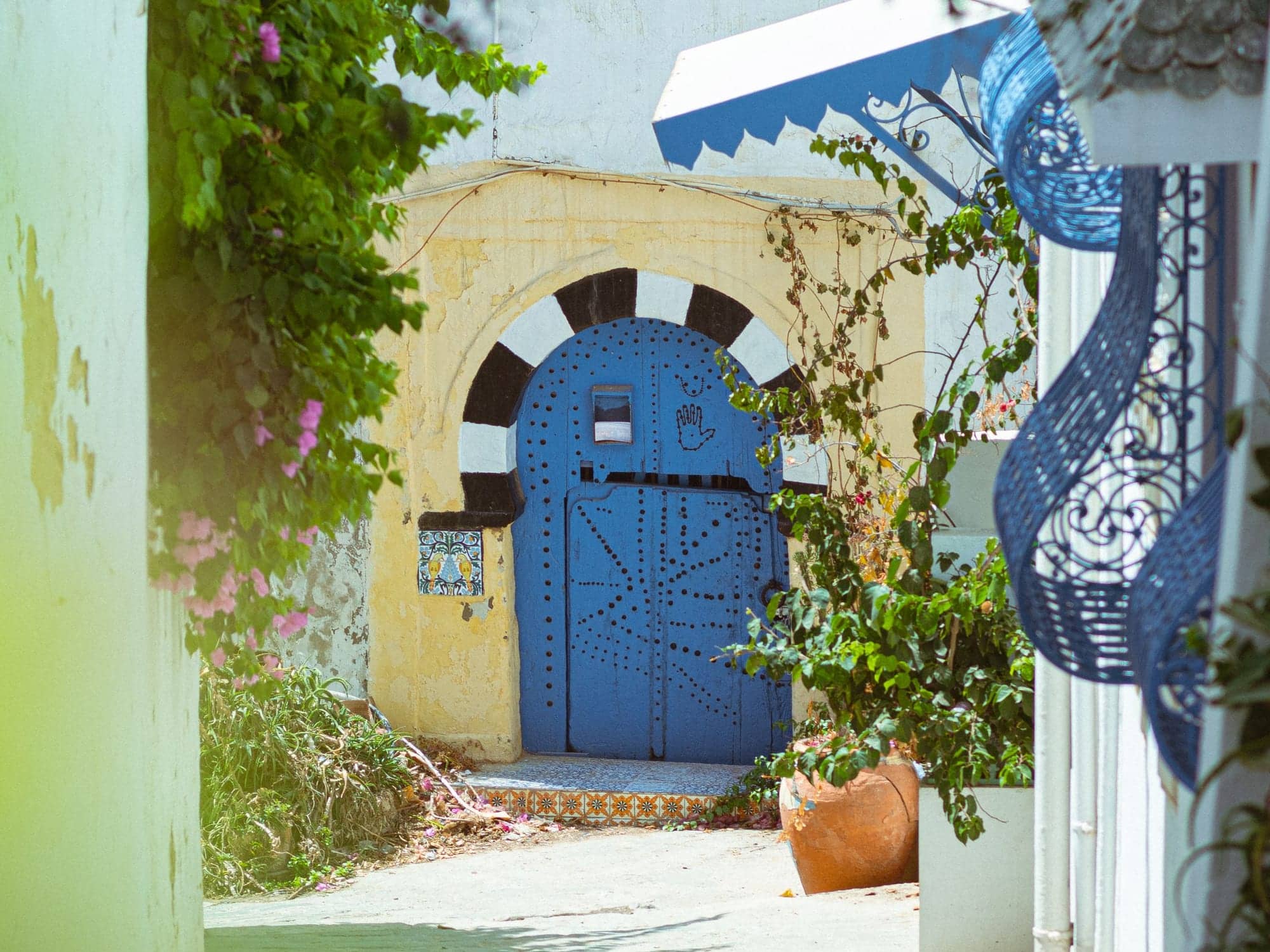 A studded cobalt-blue door in Sidi Bou Saïd